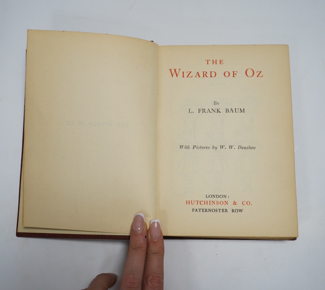 Baum, Frank - The Wizard of Oz, illustrated by W.W. Denslow, 12mo, pictorial front board over red cloth, Hutchinson & Co, London, [1926].